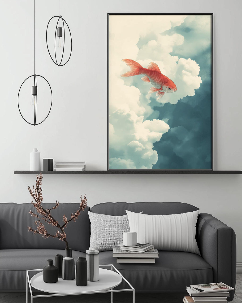 a large, framed painting of a goldfish swimming in the clouds, hanging on a wall above a gray couch with a coffee table in front of it.