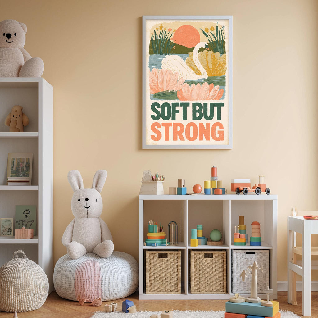 A child's bedroom with a stuffed rabbit, a shelf with toys, and a framed poster on the wall that says "Soft but Strong".