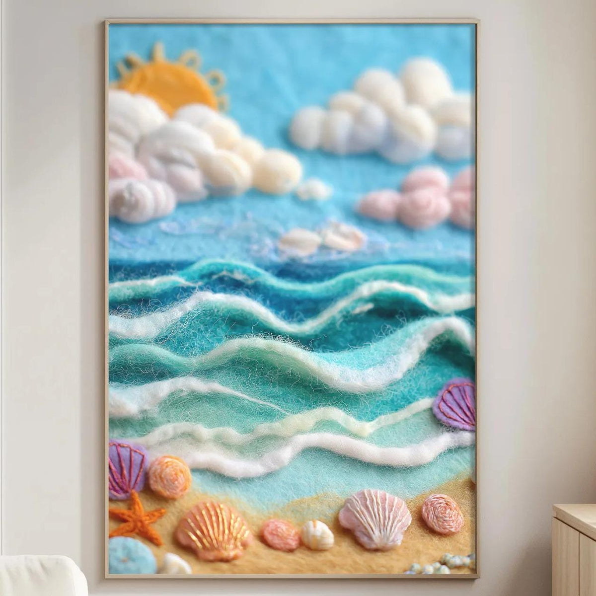 a large framed painting of a seascape with a beach scene, including shells, waves, and a sun.
