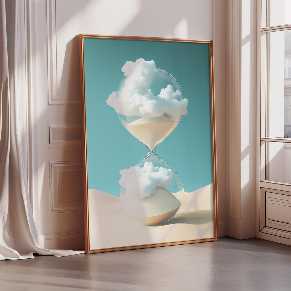 a large framed artwork depicting a glass hourglass with clouds inside, placed on a wooden floor against a white wall.
