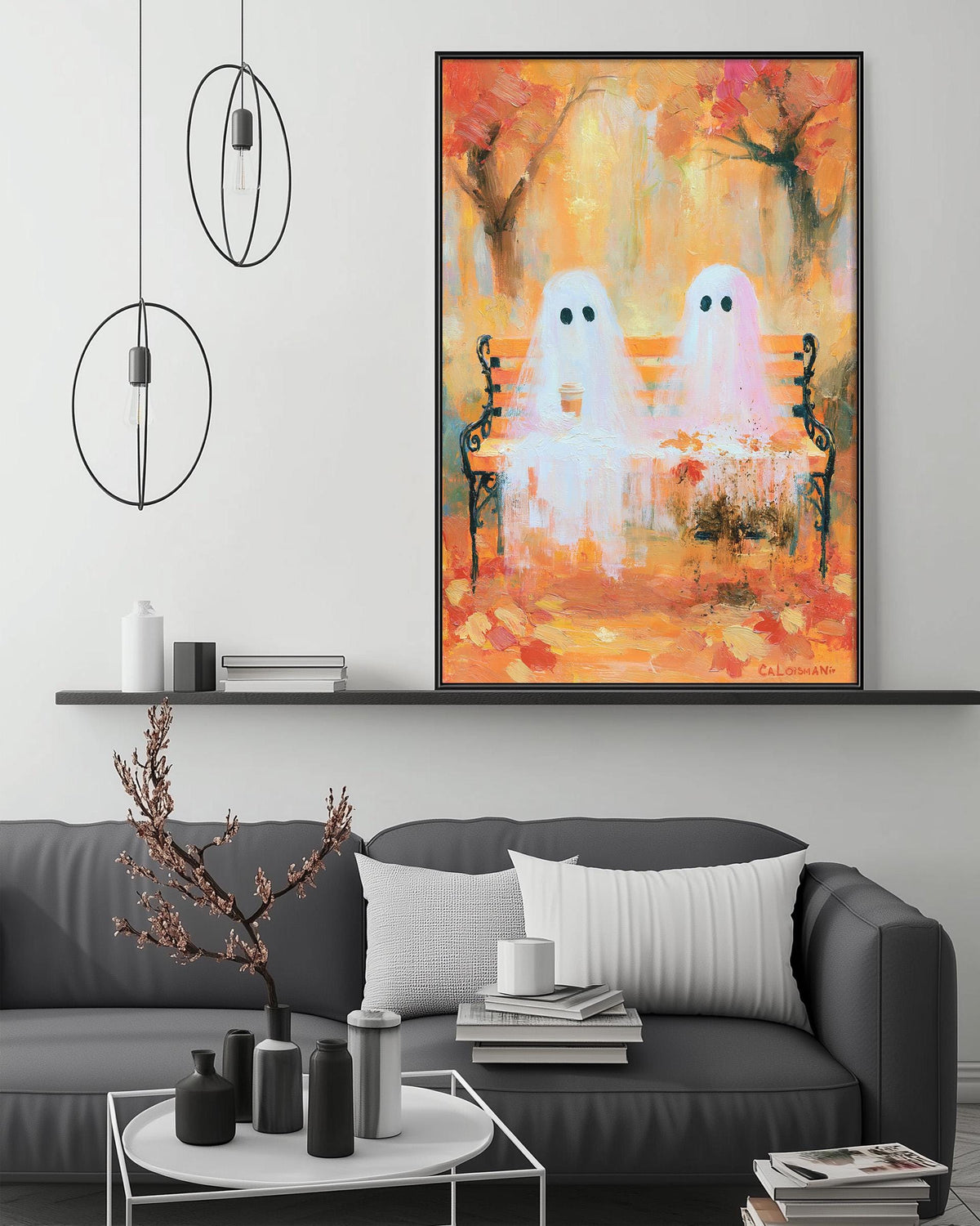 a cozy living room with a gray couch, a coffee table, and a large painting of two ghostly figures sitting on a bench. The painting is hanging on the wall above the couch, creating a focal point in the room.