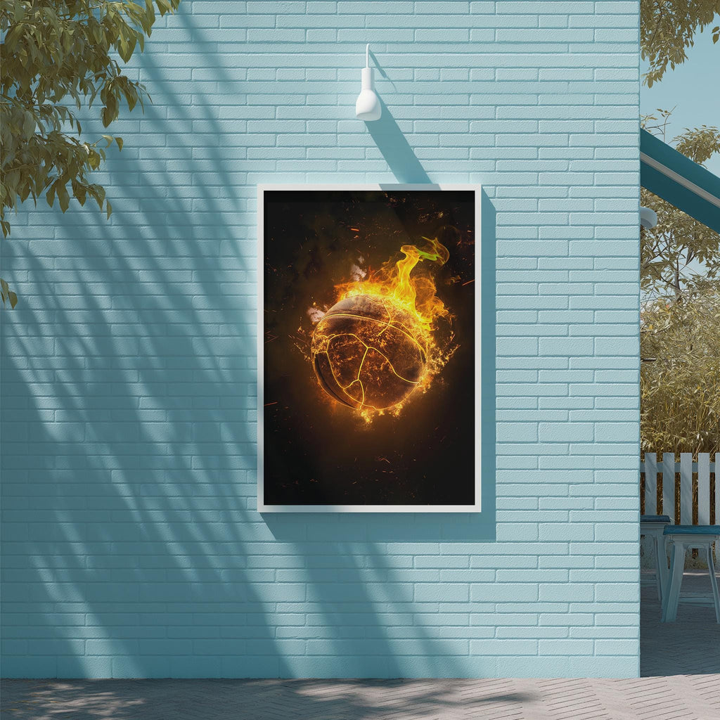 a framed artwork depicting a fiery basketball surrounded by flames, mounted on a blue wall.