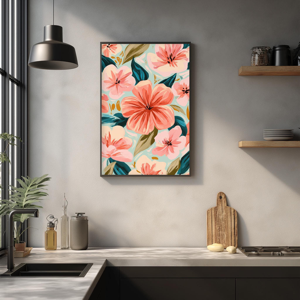 a kitchen counter with a framed floral print hanging on the wall above it. The print is a vibrant display of pink and green flowers, creating a lively and colorful atmosphere in the kitchen.