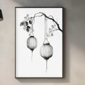 a minimalist kitchen interior with a framed black and white illustration of a branch with hanging lanterns as the focal point. The kitchen counter has various items such as a cutting board, a bottle, and a vase, creating a cozy and functional space.