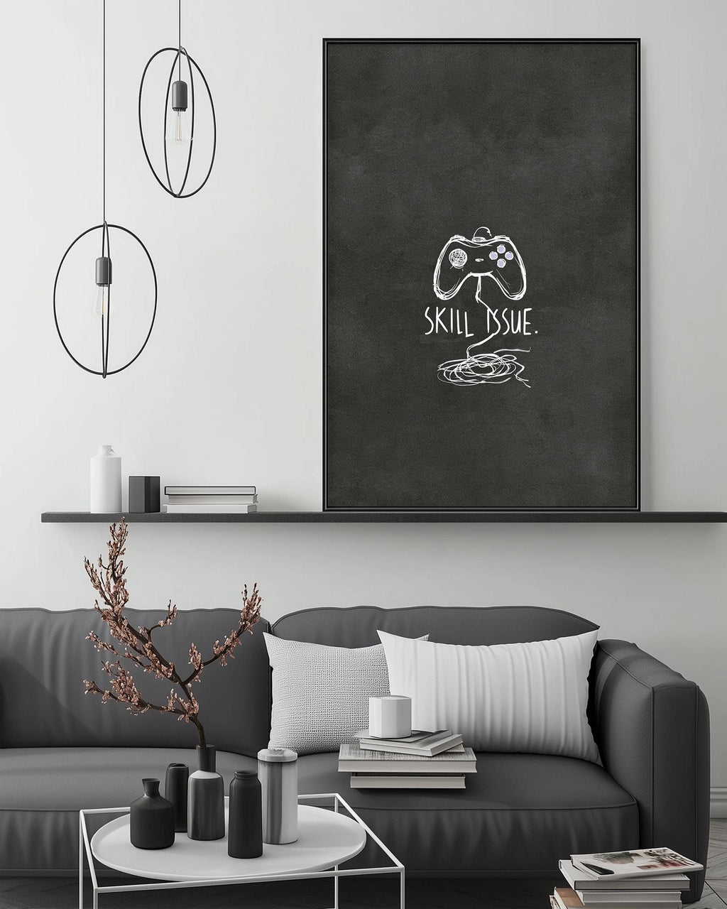a modern living room with a gray sofa, a coffee table, and a large black and white artwork on the wall. The artwork displays a game controller and the text "Skill Issue".
