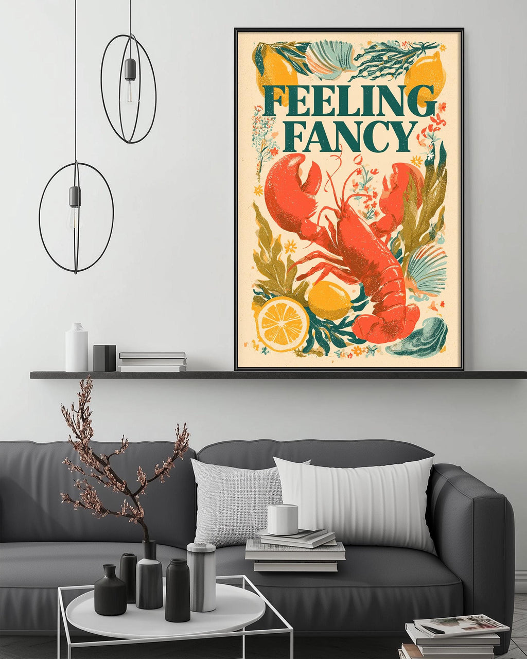 a framed poster of a lobster on a wall, with the text "Feeling Fancy" written on it. The poster is surrounded by various decorative elements, such as a potted plant, a vase, and a stack of books. The couch in the foreground has a white pillow on it, and there are some books and a cup on a coffee table nearby.