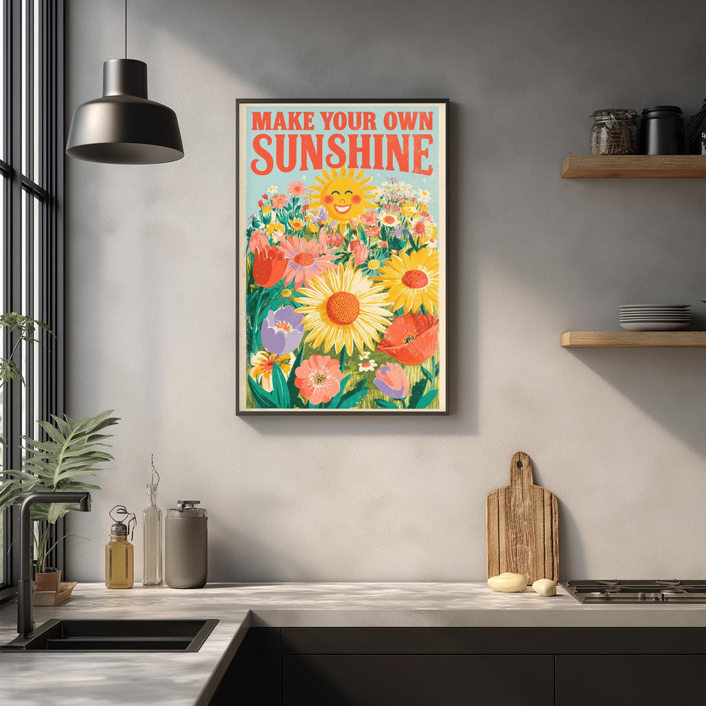 a framed poster with a cheerful illustration of a sunflower and flowers hanging on a wall above a kitchen counter.