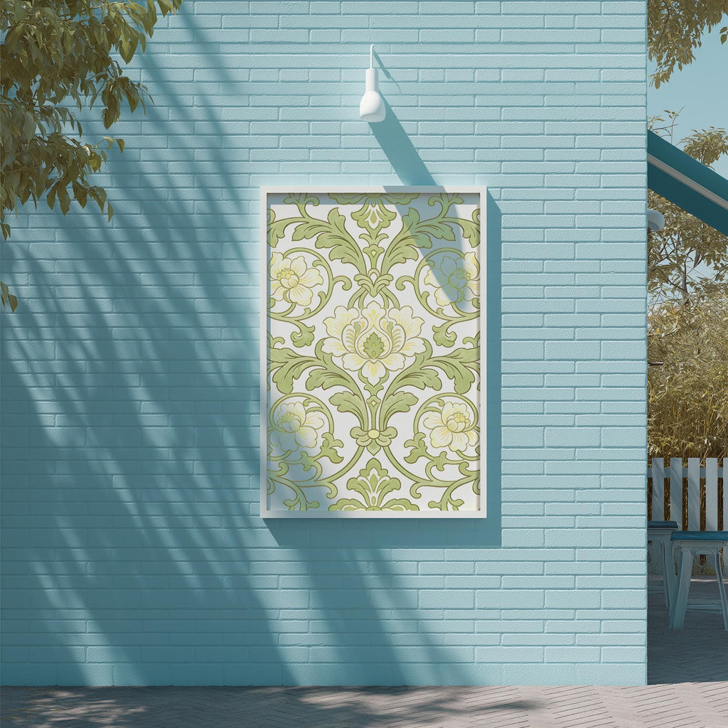 a blue brick wall with a framed picture hanging on it. The picture has a floral pattern in shades of green and white. The wall is situated next to a wooden deck and a tree, creating a serene outdoor setting.