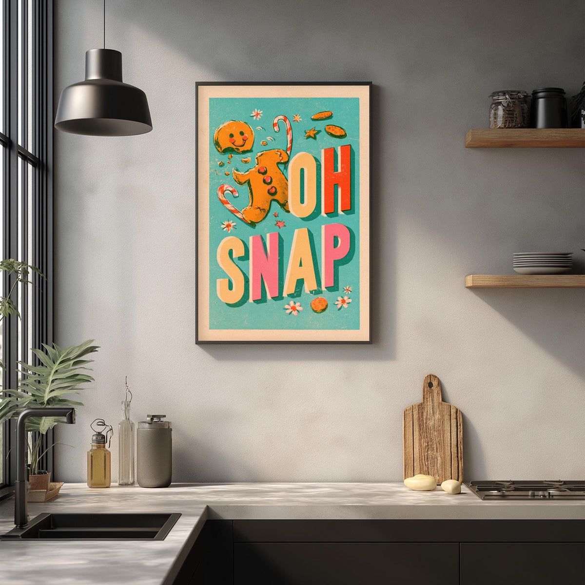 a kitchen counter with various kitchen items, such as a cutting board, a sink, and a potted plant. Above the counter, there is a framed poster with the text "OH SNAK" in a colorful, playful font.