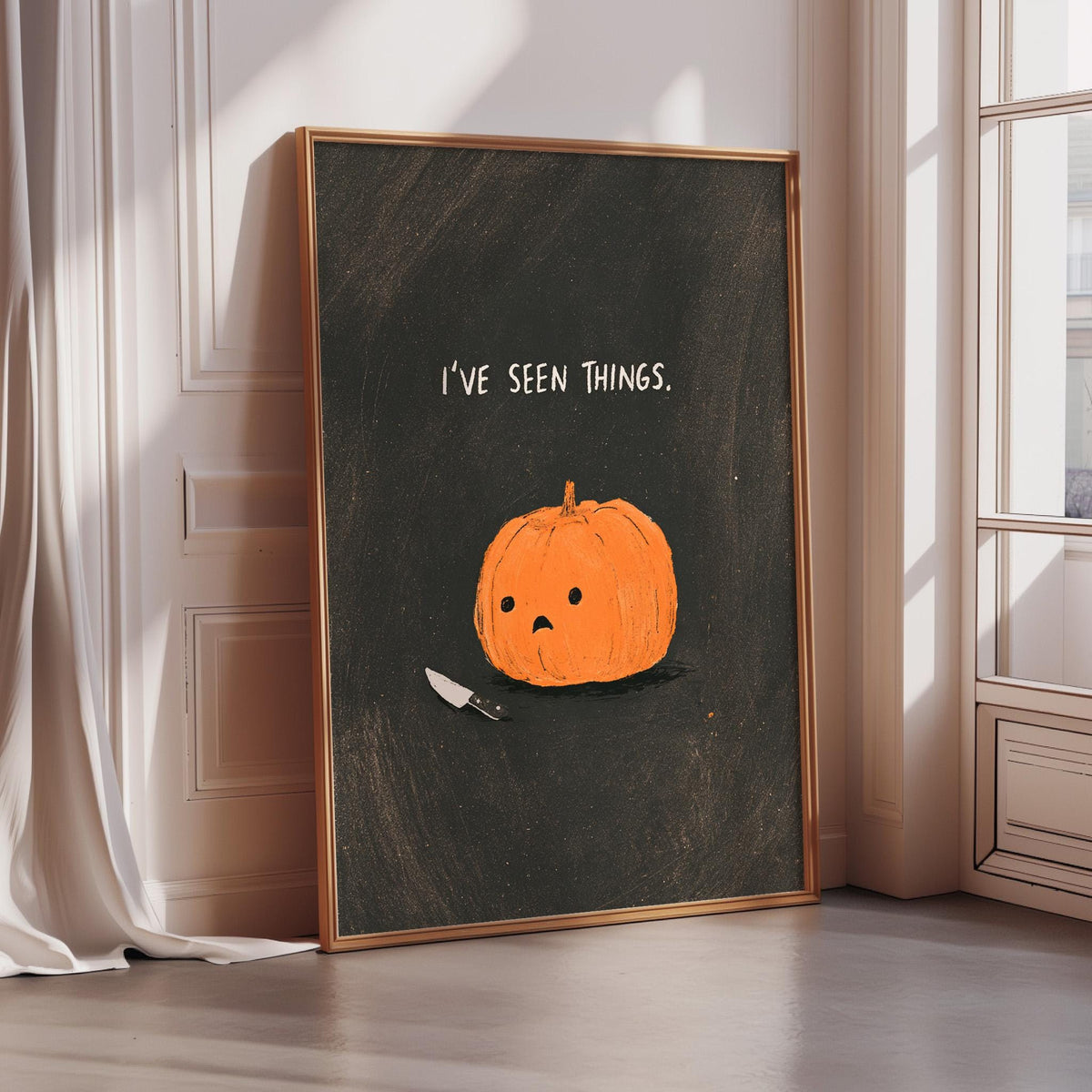 a framed illustration of a pumpkin with a knife sticking out of it, accompanied by the text "I've seen things."