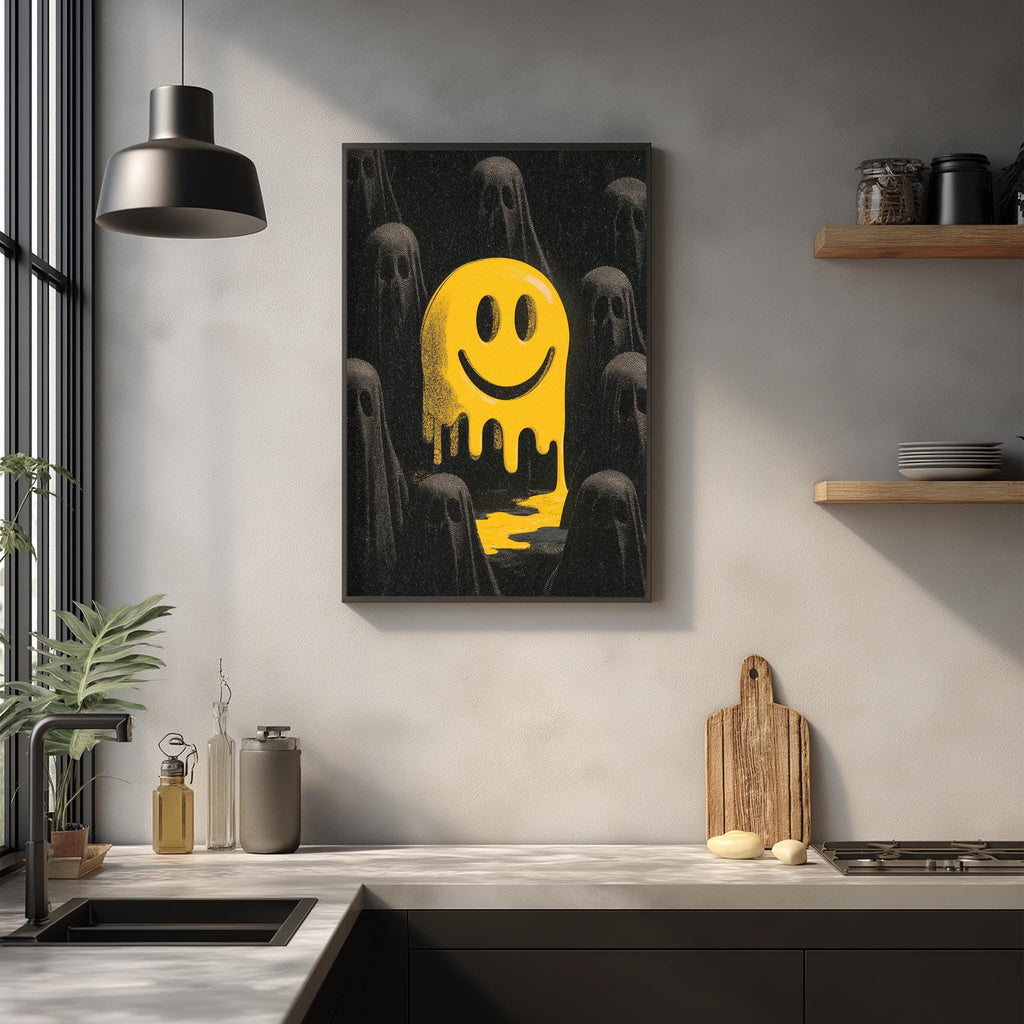 a kitchen counter with various items, including a wooden cutting board, a sink, and a potted plant. Above the counter, there is a framed artwork depicting a yellow smiley face surrounded by black silhouettes, creating a striking visual contrast.