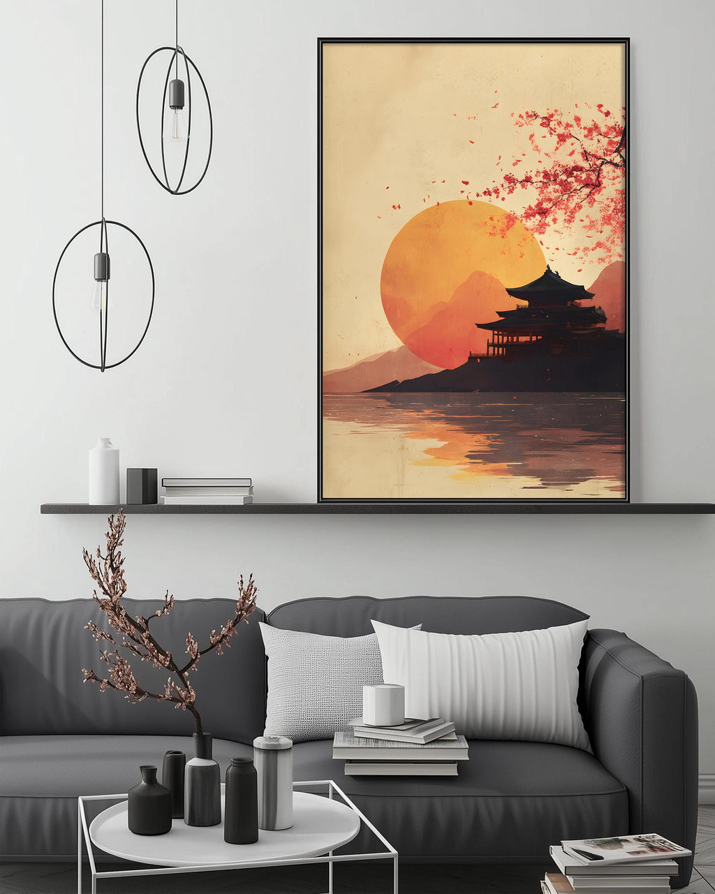 a living room with a gray sofa, a coffee table, and a large framed artwork depicting a serene sunset over a temple.