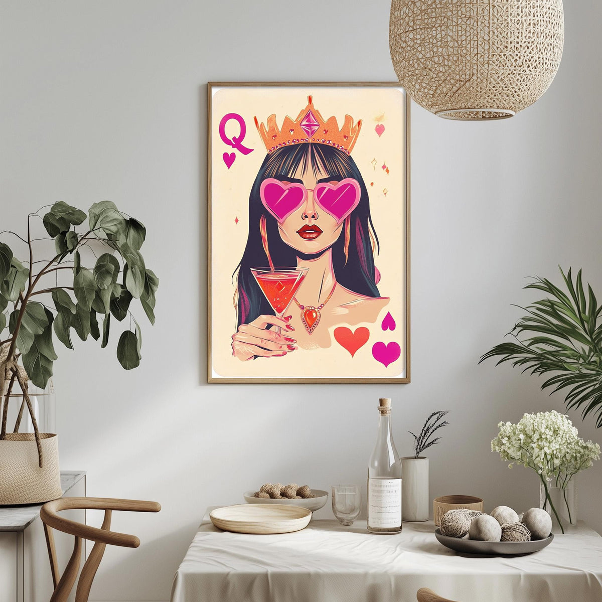 a framed illustration of a woman wearing a crown and sunglasses, holding a drink, with various decorative elements surrounding her.