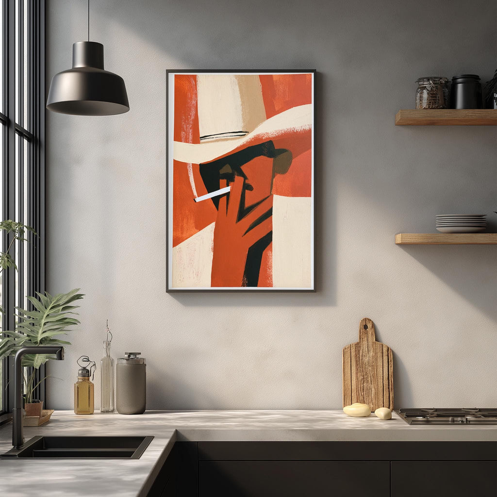 a modern kitchen with a framed abstract painting hanging on the wall above a countertop. The painting depicts a person wearing a hat and smoking a cigarette. The kitchen countertop has various items, including a cutting board, a bottle, and a vase. The overall scene has a minimalist and contemporary design.