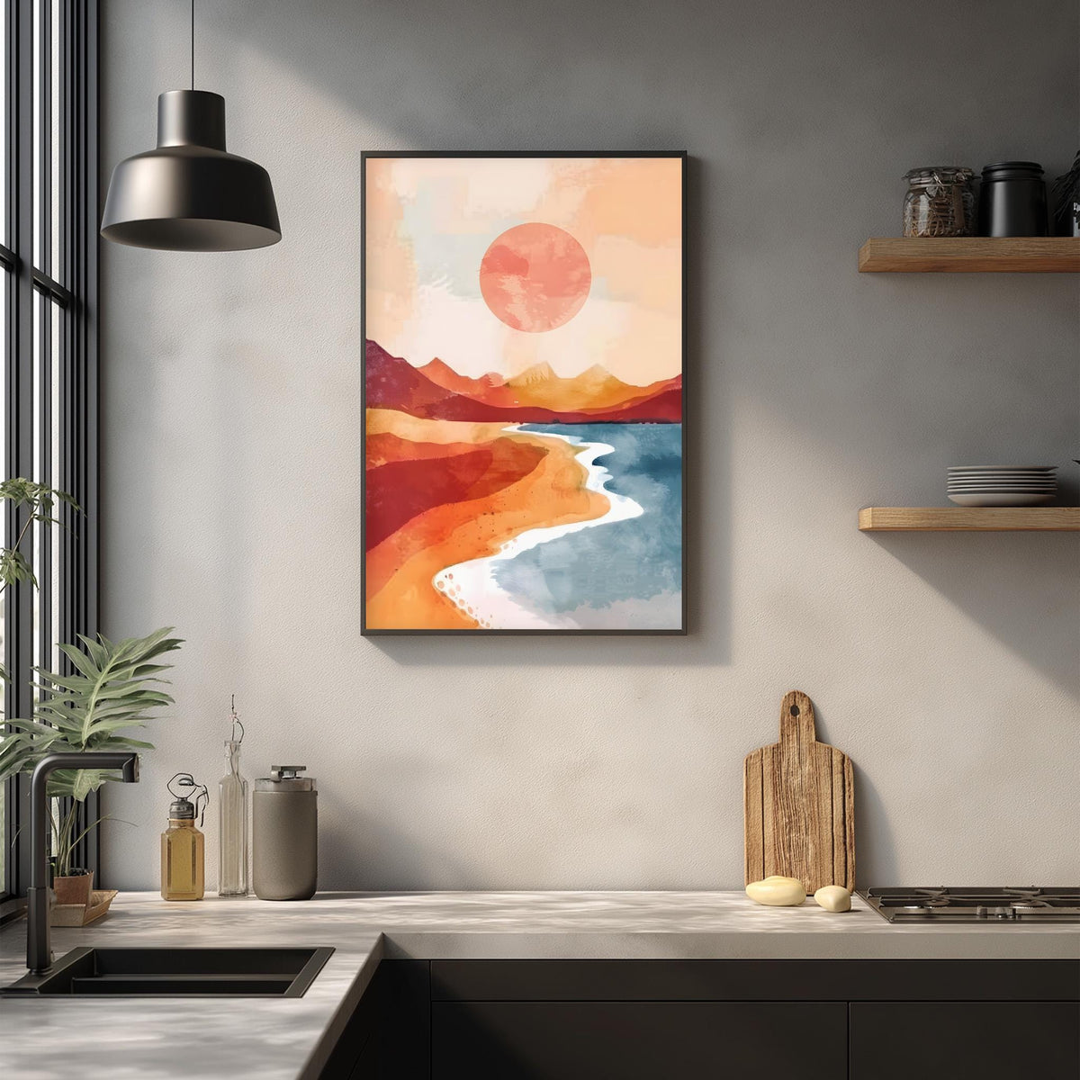 a kitchen counter with a framed painting of a beach scene hanging above it. The painting depicts a beach with a red sun in the sky, mountains in the background, and a blue ocean. The kitchen counter has various items on it, including a cutting board, a bottle, and a vase.