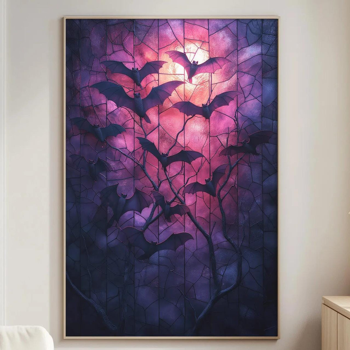 a large framed artwork depicting bats in a dark, purple-hued forest setting, hanging on a wall in a living room.