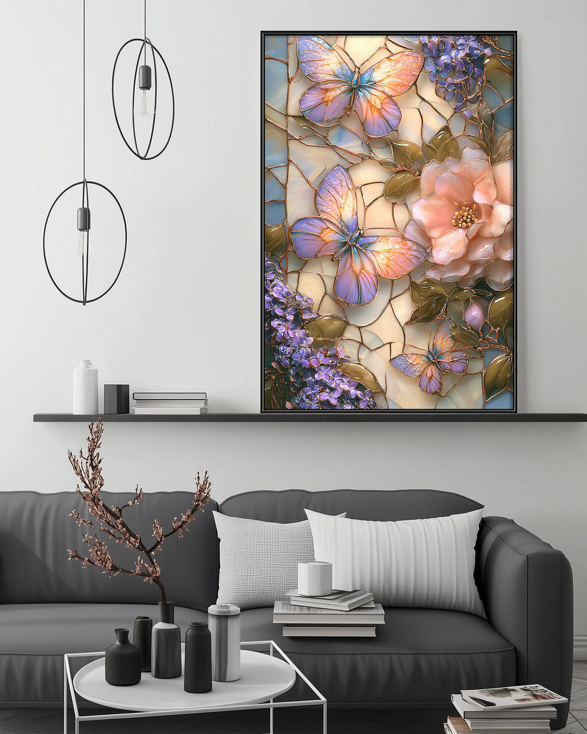 a large framed artwork depicting a vibrant and colorful butterfly scene, with the butterfly's wings spread wide and the flowers surrounding it. The artwork is displayed on a wall above a gray couch, which is adorned with various decorative items such as vases, books, and a potted plant. The overall setting appears to be a cozy and inviting living space.
