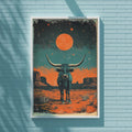 a large framed poster of a bull with horns, set against a desert landscape with a large orange moon and stars in the night sky.