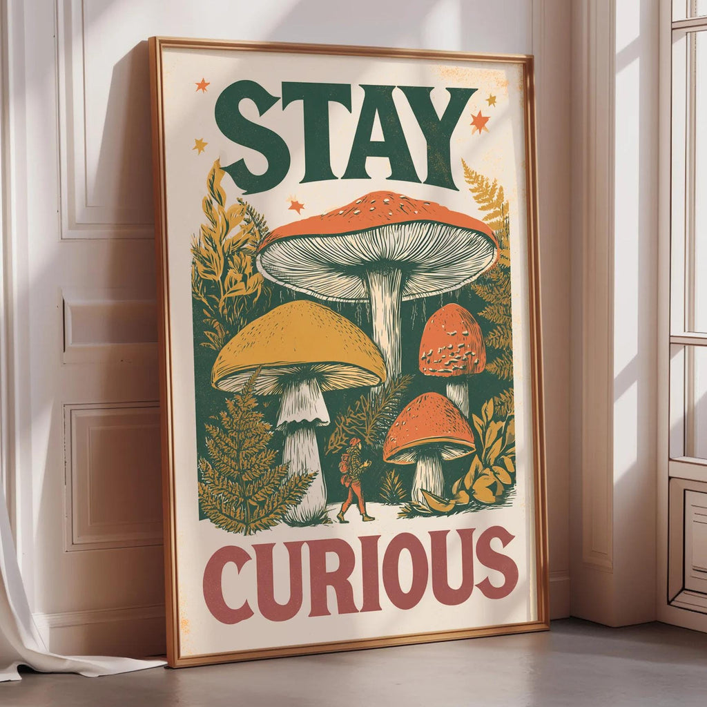 a framed poster with a mushroom and plant illustration, along with the text "STAY CURIOUS" displayed prominently.