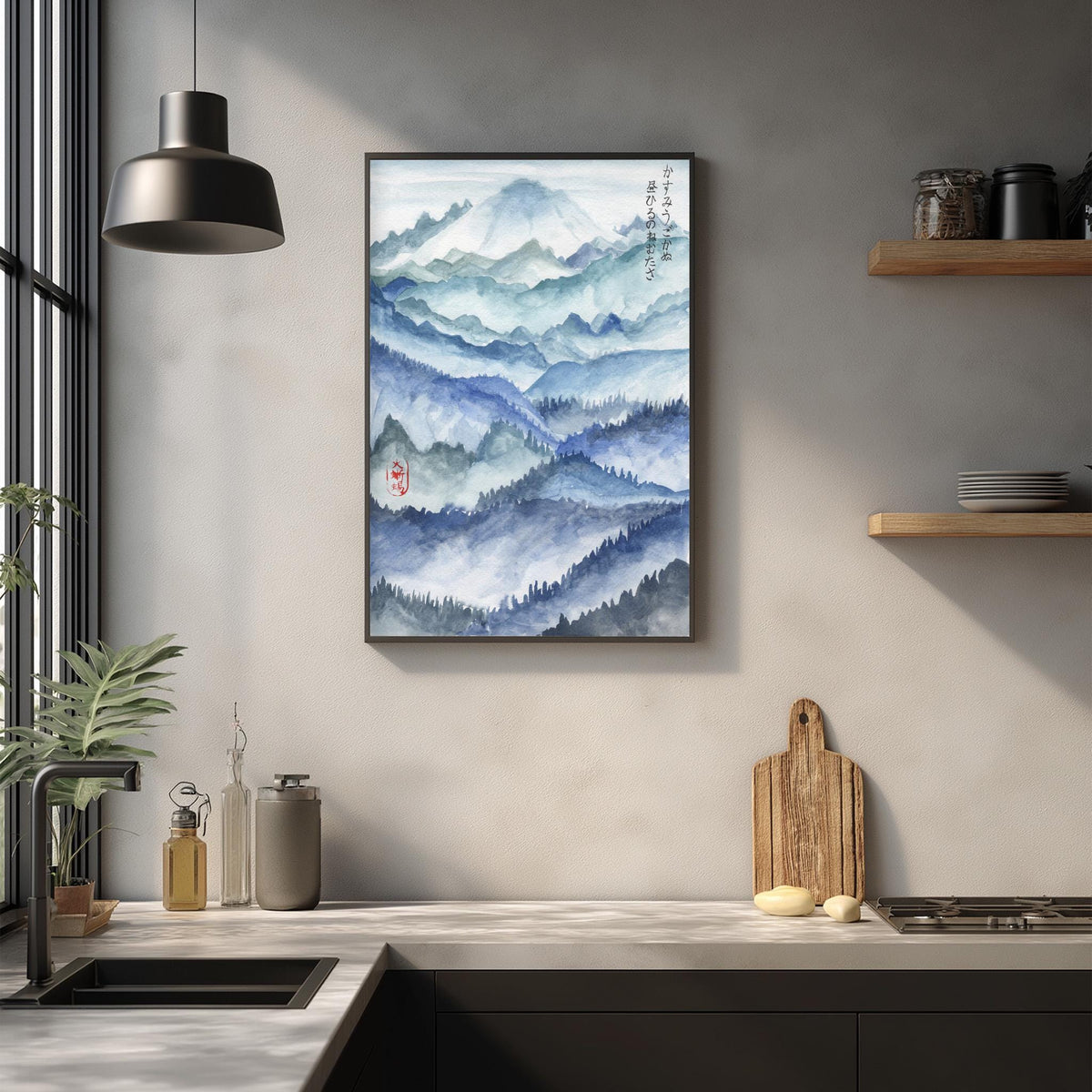 a kitchen counter with a framed watercolor painting of a mountain landscape hanging above it. The painting depicts a serene mountain scene with a blue sky and green trees. The kitchen counter has various items on it, including a cutting board, a bottle, and a vase. The overall scene has a calming and natural atmosphere.