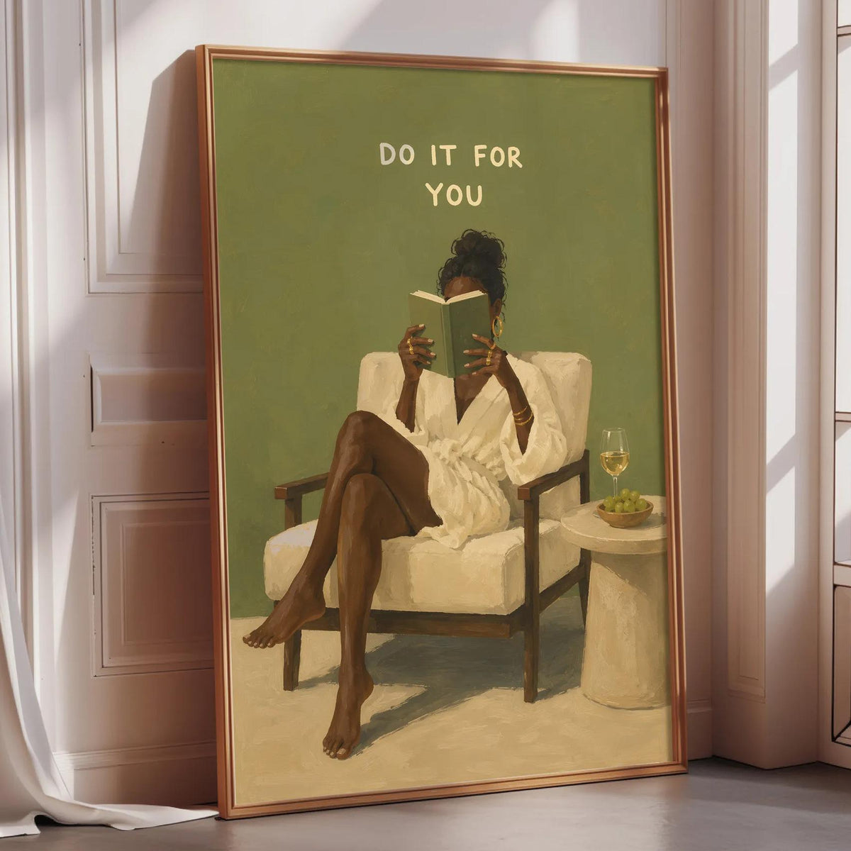 a woman sitting in a chair, reading a book, with a green wall behind her and a window to her right.