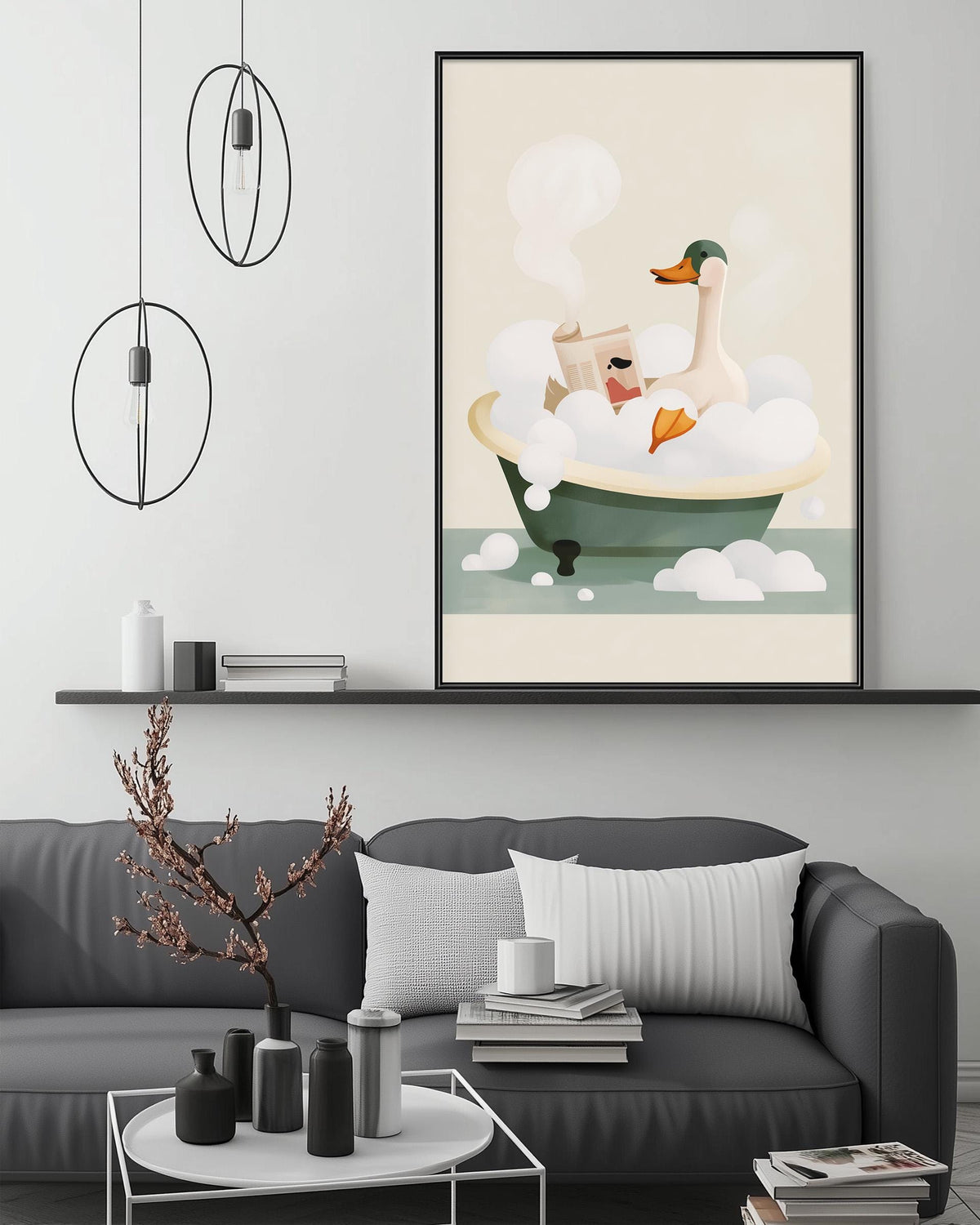 a cozy living room with a gray couch, a coffee table, and a framed illustration of a duck taking a bath in a tub.