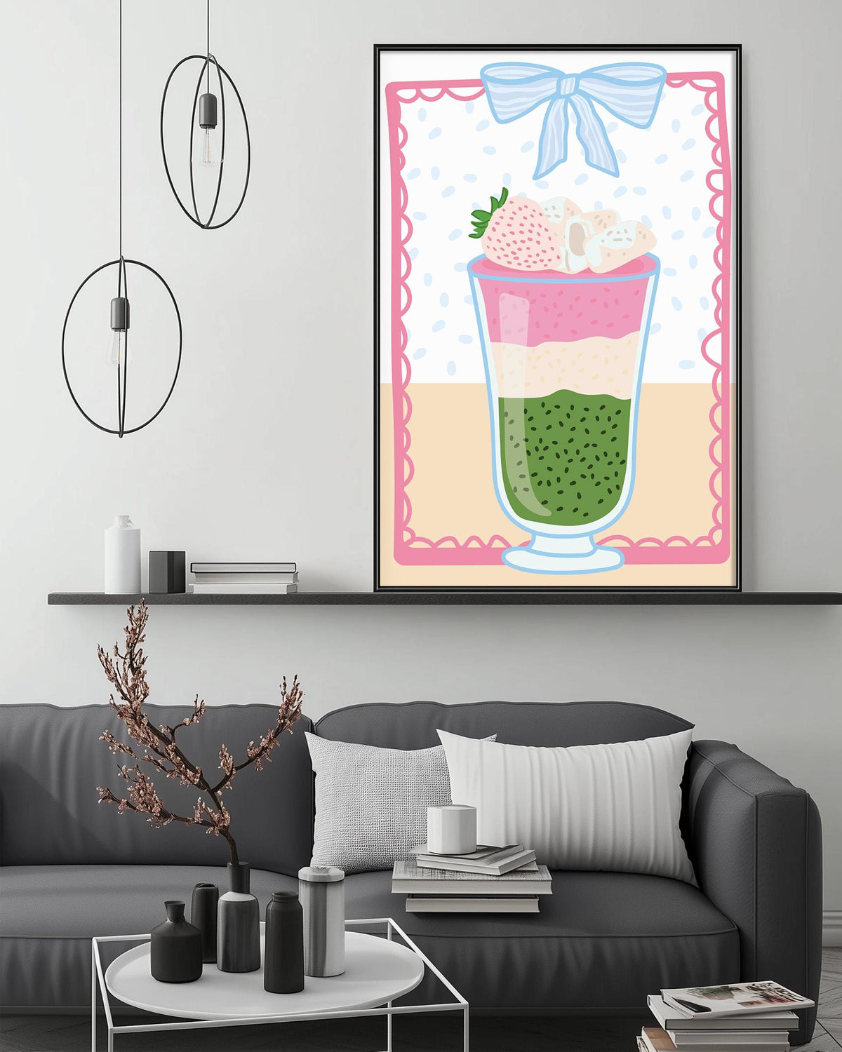 a cozy living room with a gray couch, a coffee table, and a large framed illustration of a colorful layered drink on the wall.