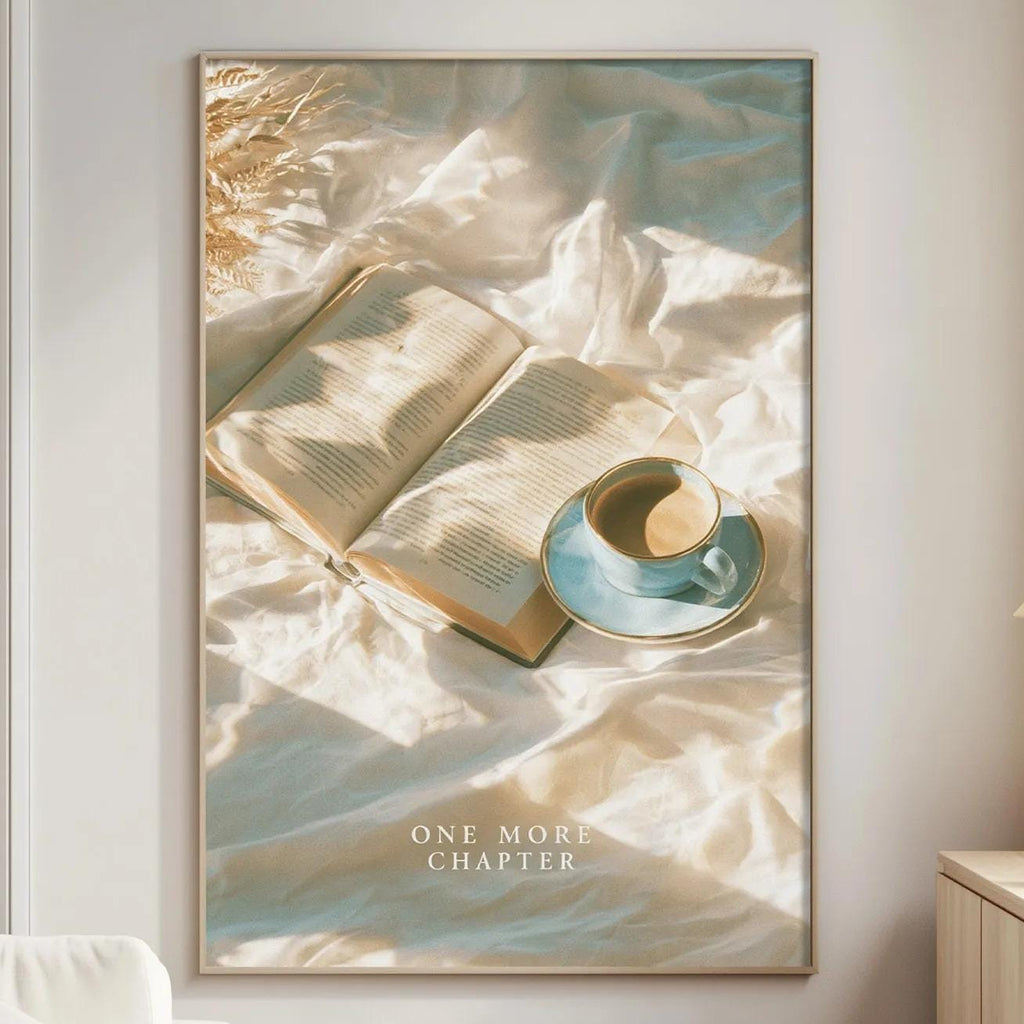 a cozy living room with a large framed poster of an open book and a cup of coffee on a bed, creating a serene and inviting atmosphere.