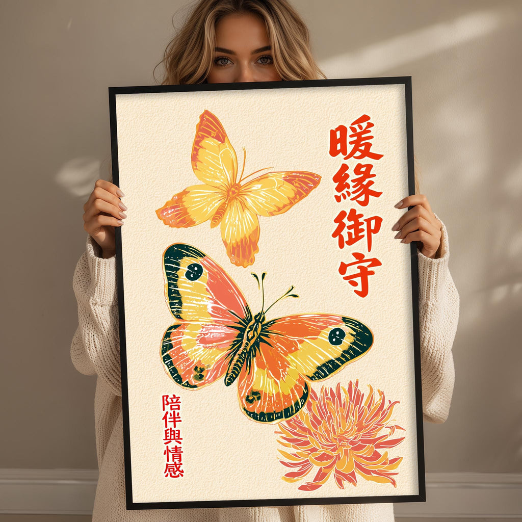 A woman holding a framed print with a butterfly and a flower design.