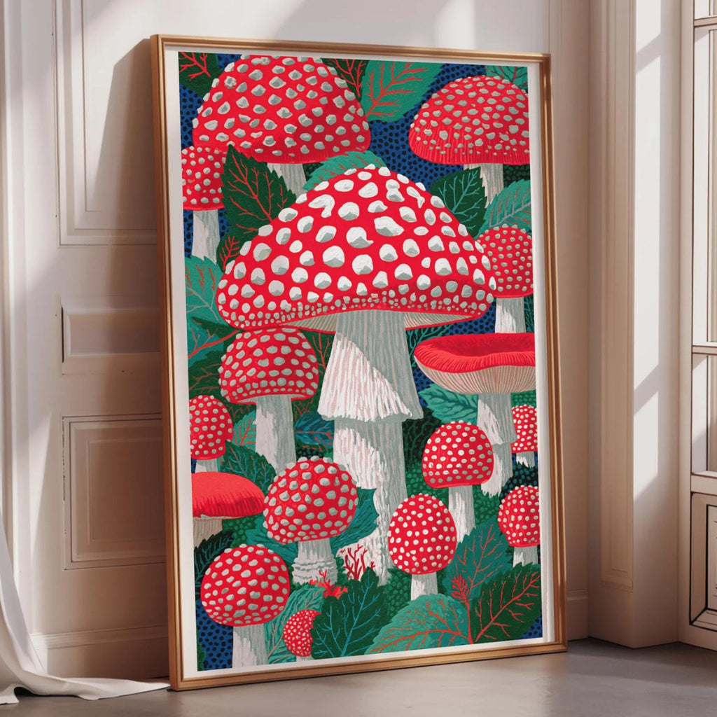a large framed artwork depicting a vibrant and colorful scene of red and white mushrooms against a lush green background.