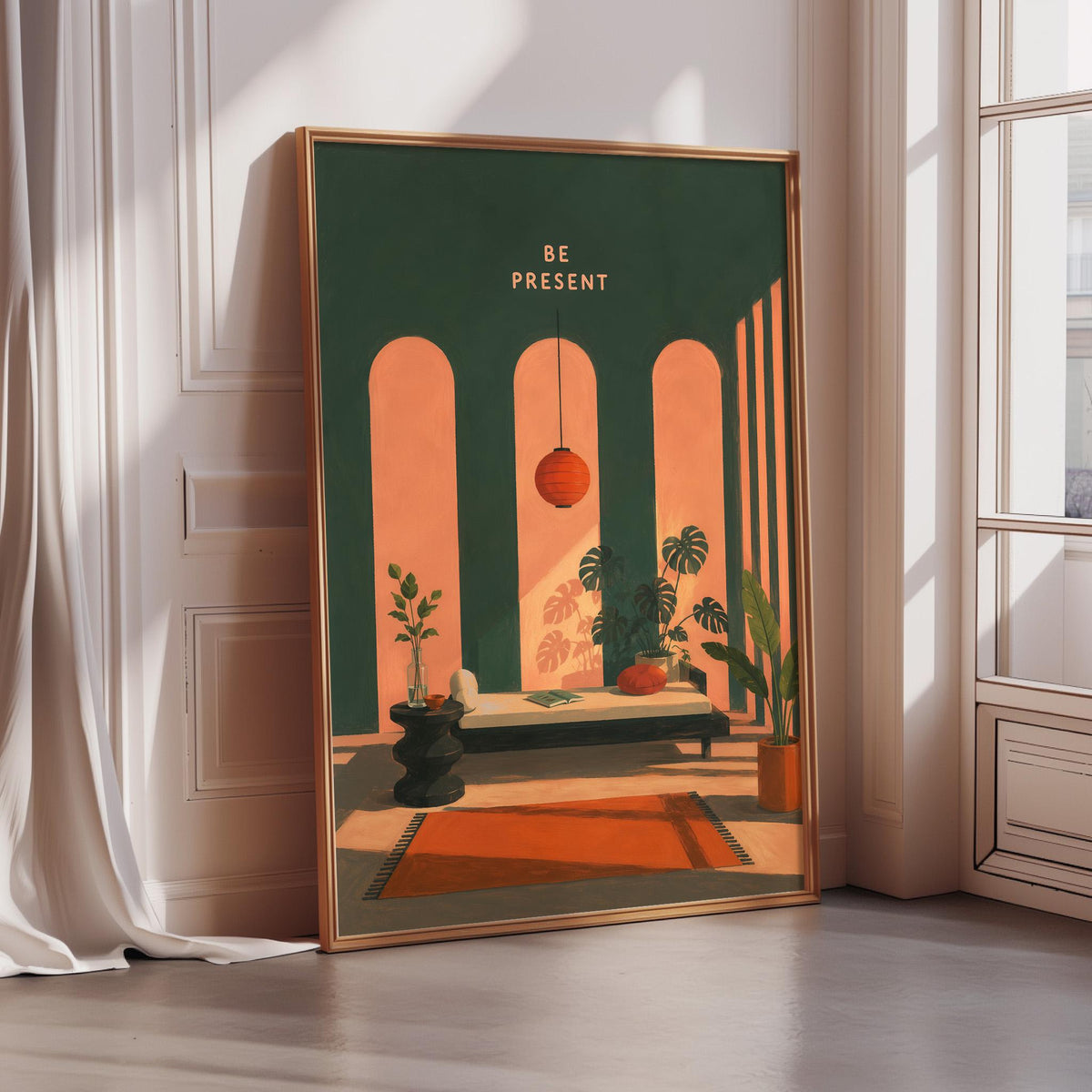 a framed poster with a vibrant illustration of a living room scene, including a sofa, potted plants, and a lamp. The text "BE PRESENT" is prominently displayed on the poster, suggesting a message about being present in the moment.