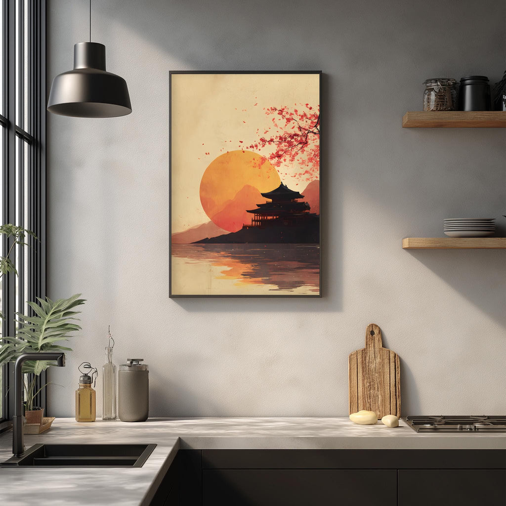 a kitchen scene with a framed artwork depicting a serene sunset over a traditional Japanese temple. The artwork is hung on the wall above a kitchen counter, which has various kitchen items such as a cutting board, a bottle, and a vase. The overall color palette of the image is warm, with the sunset casting a soft glow on the scene.
