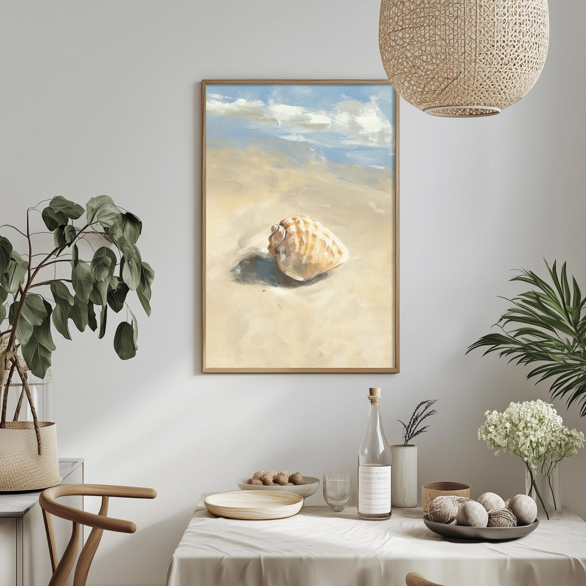 a serene beach scene with a framed painting of a shell resting on the sand, surrounded by potted plants and a dining table with a bottle of wine and other decorative items.