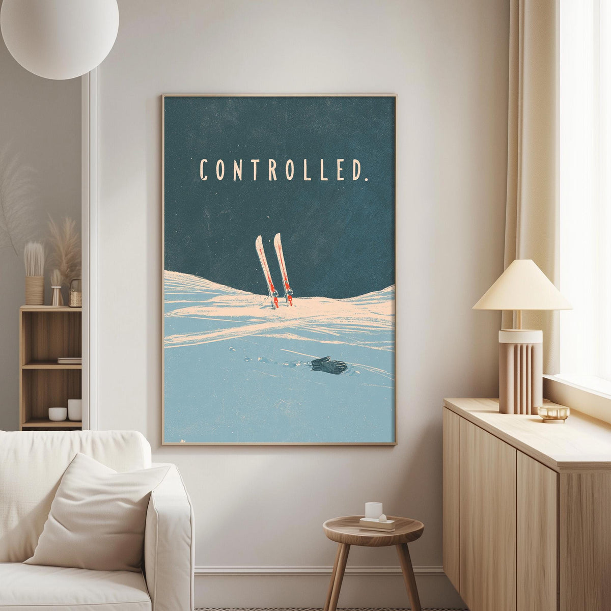 a large framed poster with the word "controlled" on it, hanging on a wall in a living room.
