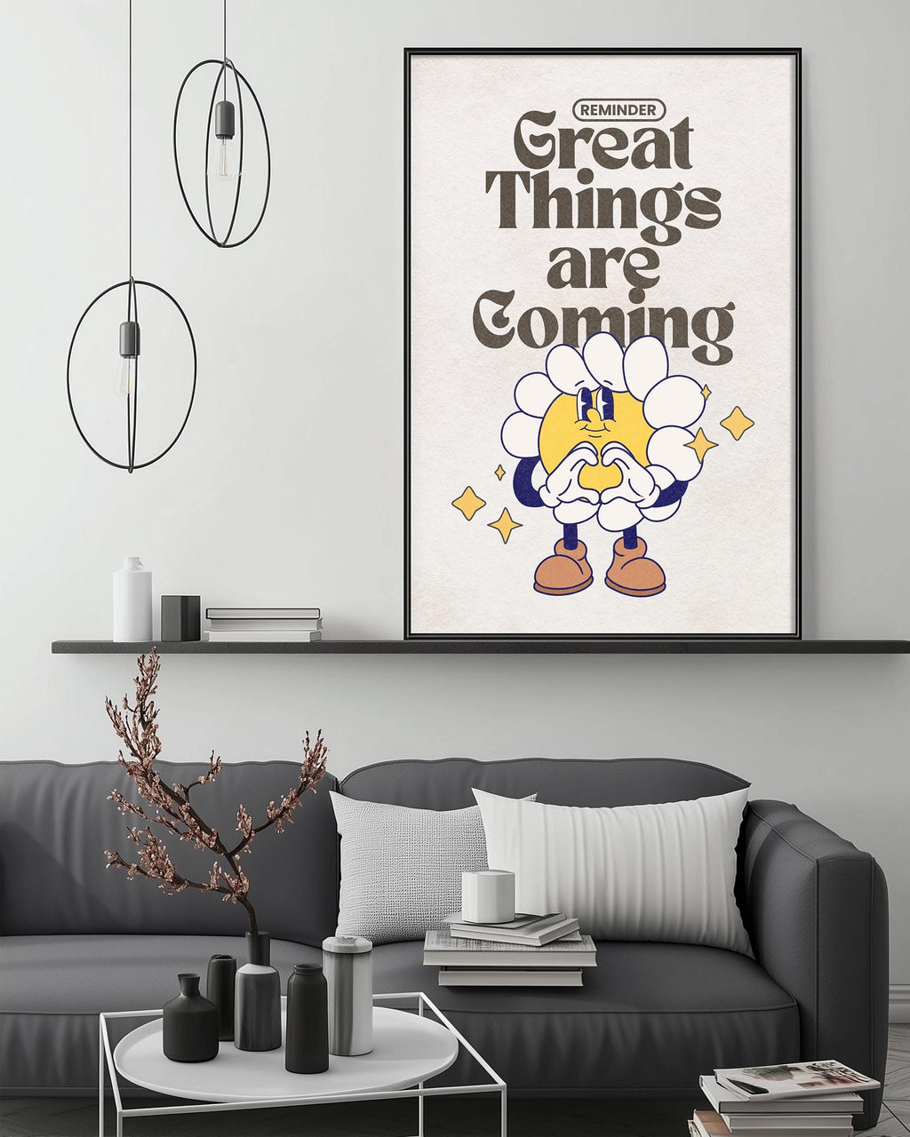 a living room with a gray couch, a coffee table, and a framed poster with a cartoon character and text on the wall.