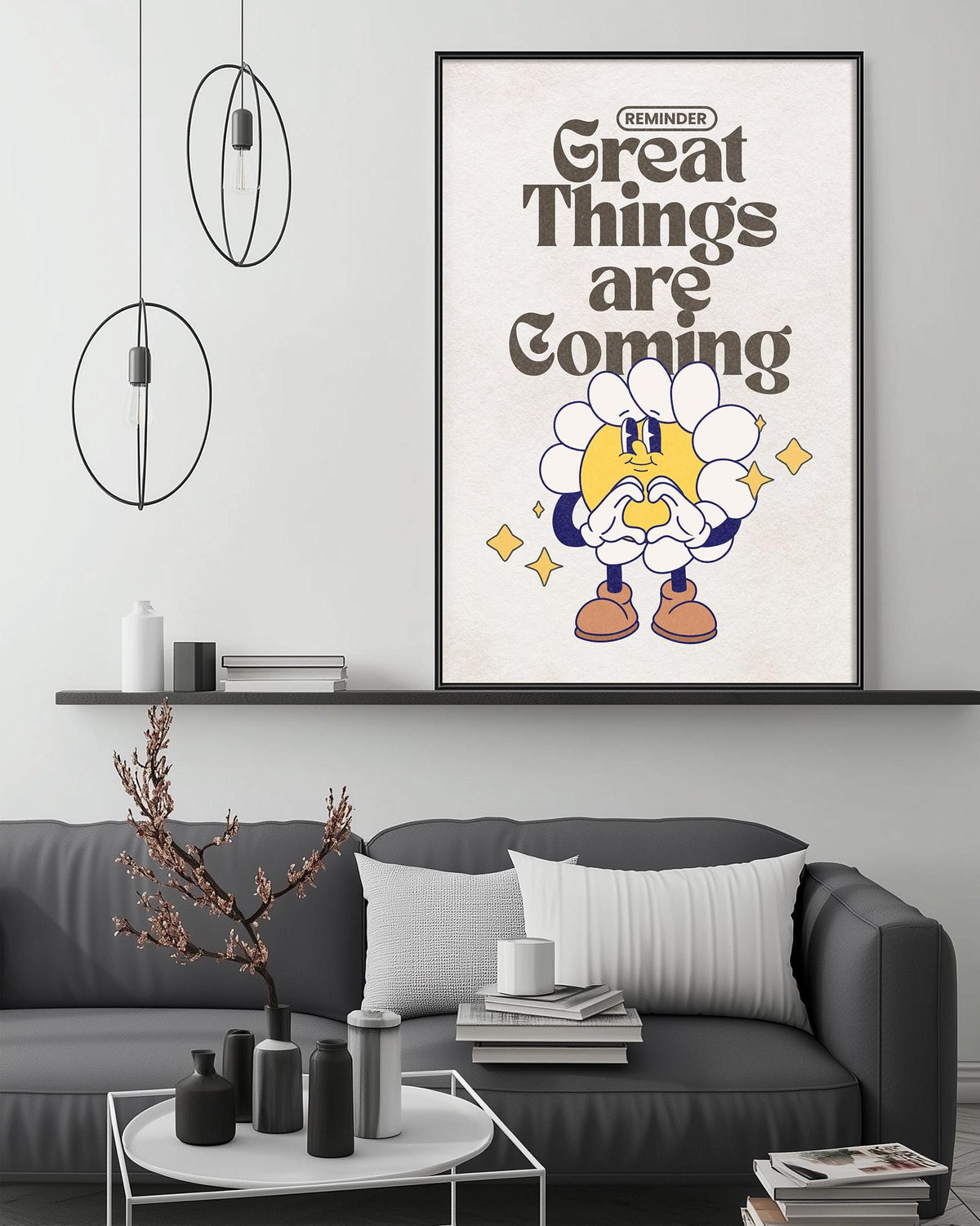 a living room with a gray couch, a coffee table, and a framed poster with a cartoon character and text on the wall.