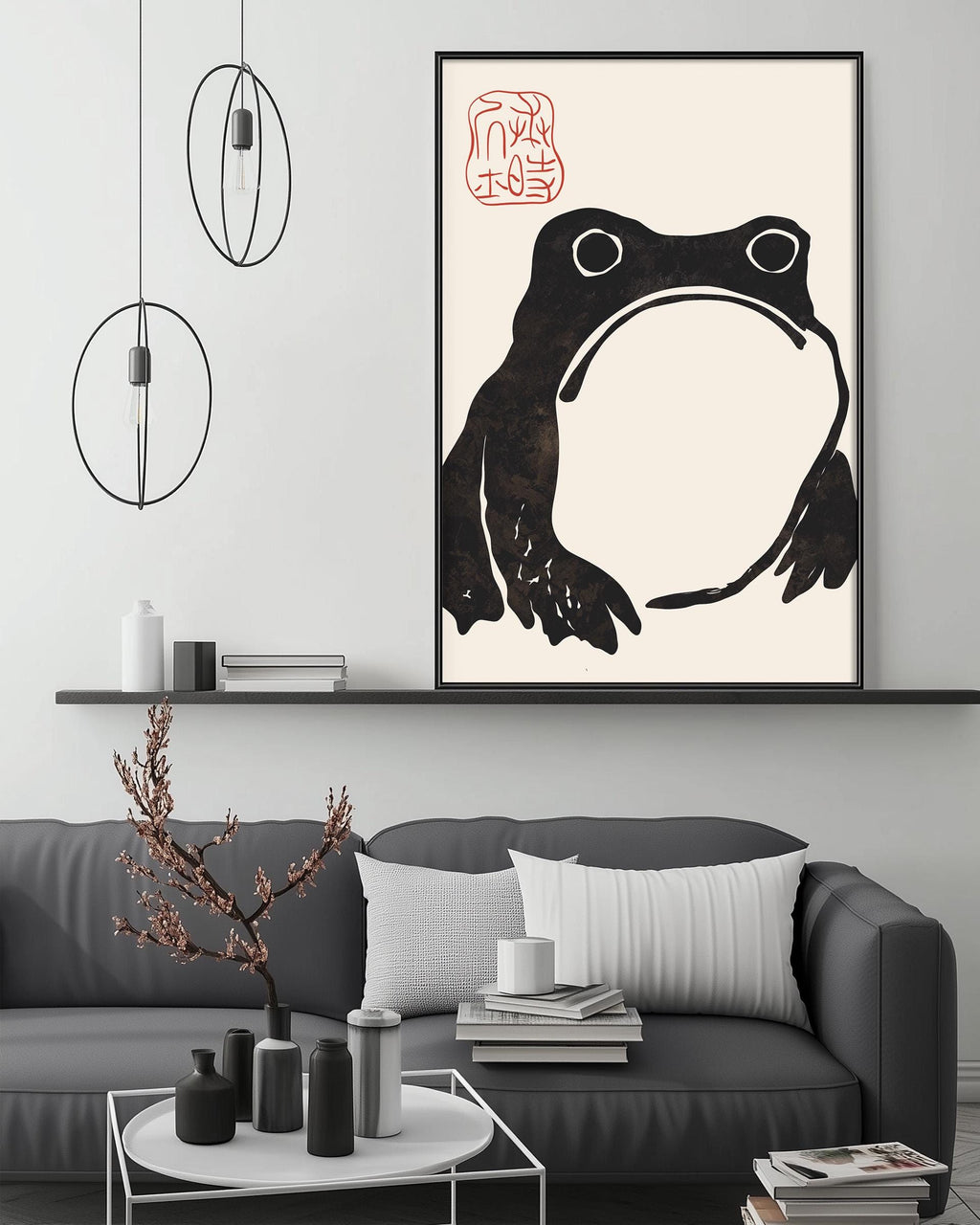 a modern living room with a gray sofa, a coffee table, and a large framed artwork of a frog on the wall.