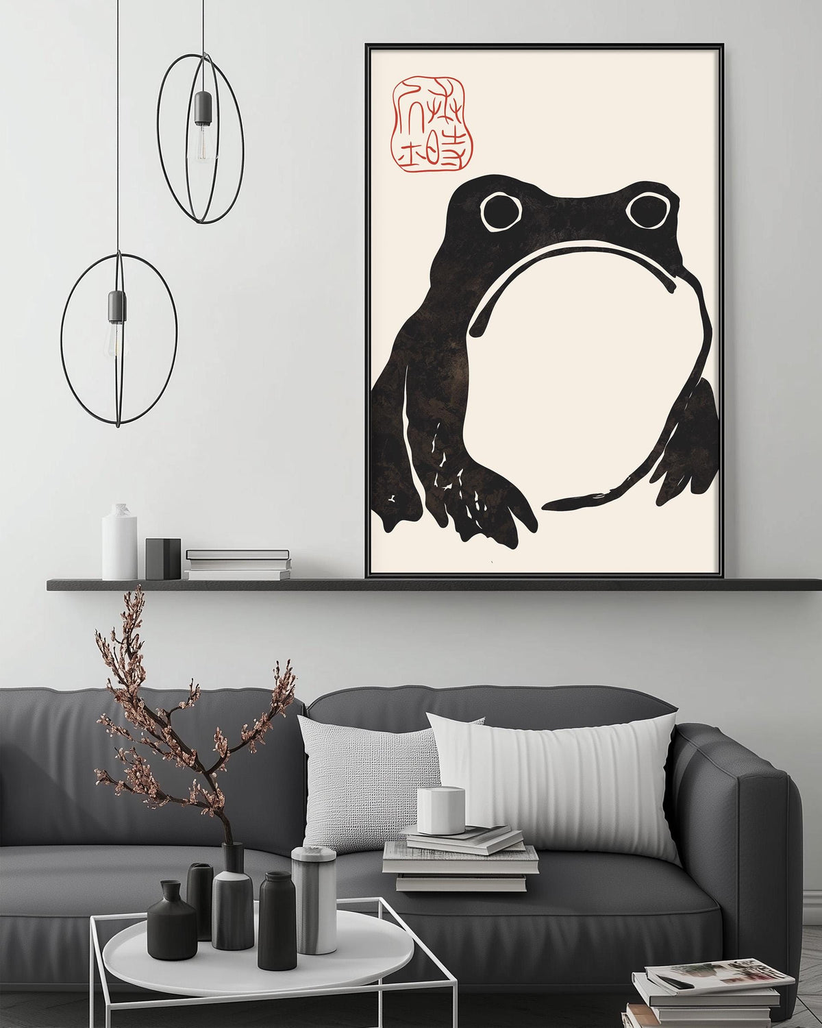 a modern living room with a gray sofa, a coffee table, and a large framed artwork of a frog on the wall.