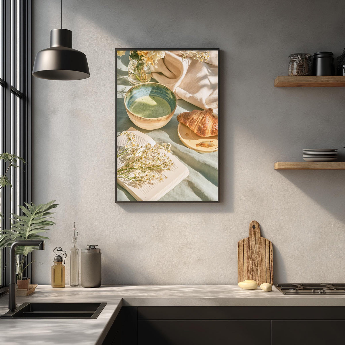 a kitchen scene with a framed picture of a breakfast spread hanging on the wall, including a bowl of fruit, a plate of croissants, and a vase of flowers.