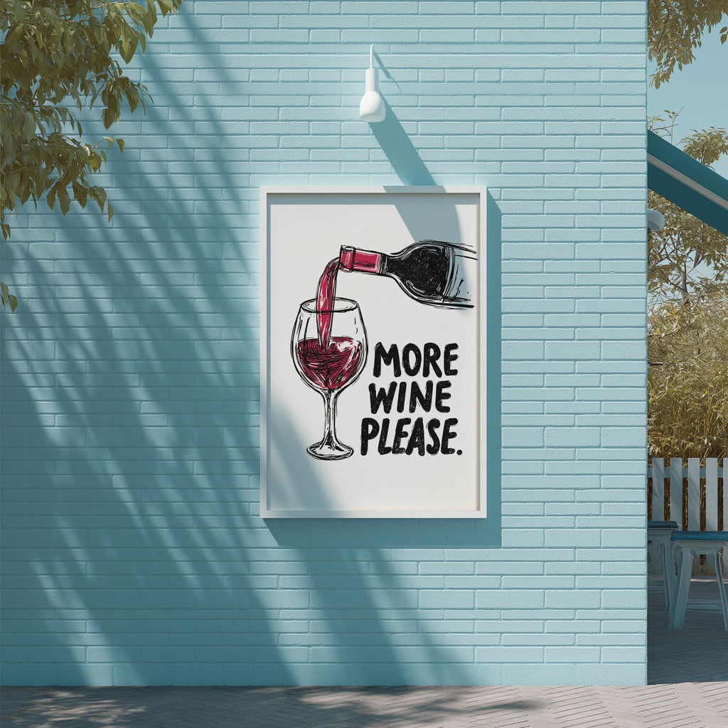 a framed poster with a wine glass and a bottle of wine, along with the text "MORE WINE PLEASE" displayed on the poster.