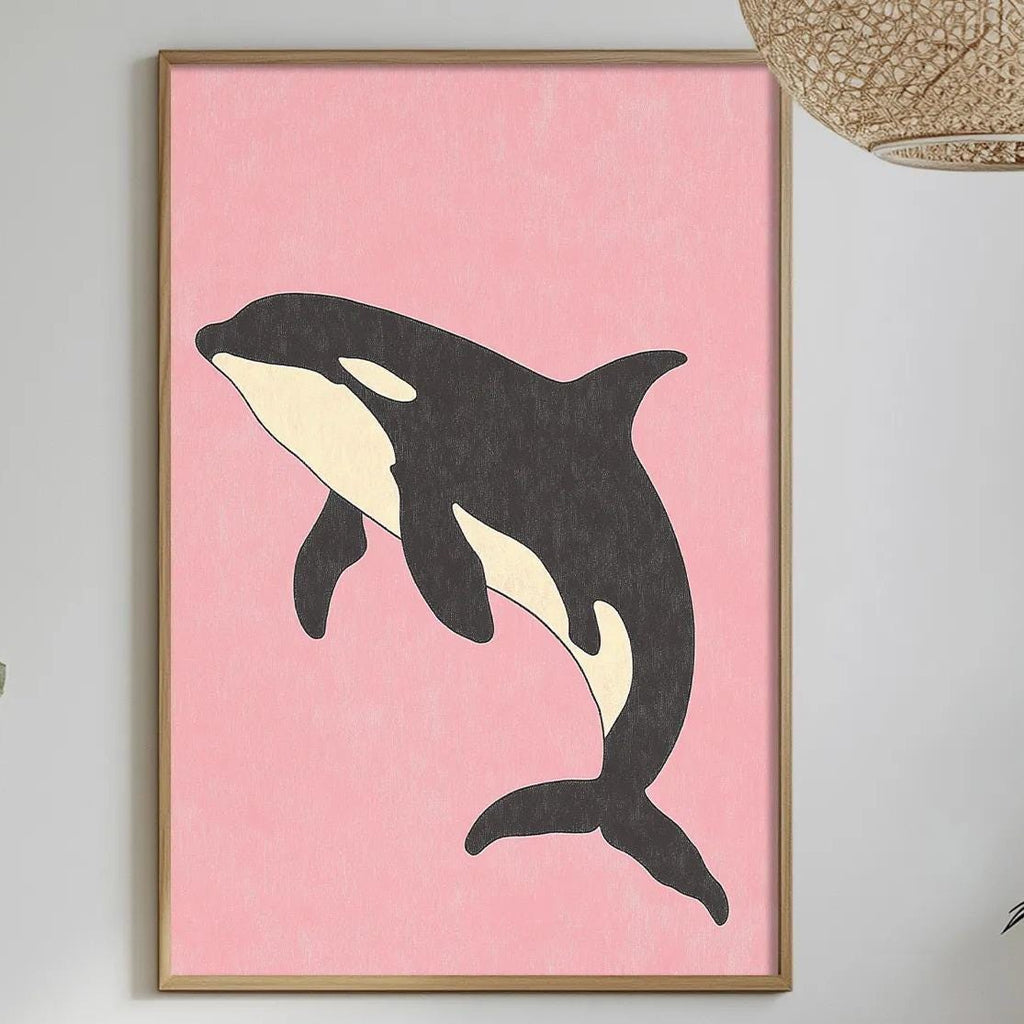 a dining table with a pink background, a framed picture of a black and white whale, and various decorative elements such as potted plants, vases, and a bowl of fruit.