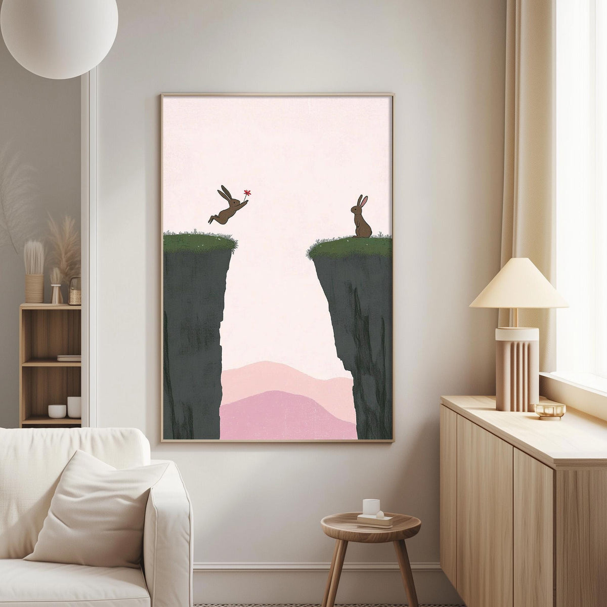 a living room with a large framed artwork hanging on the wall, featuring two rabbits on a cliff overlooking a valley.