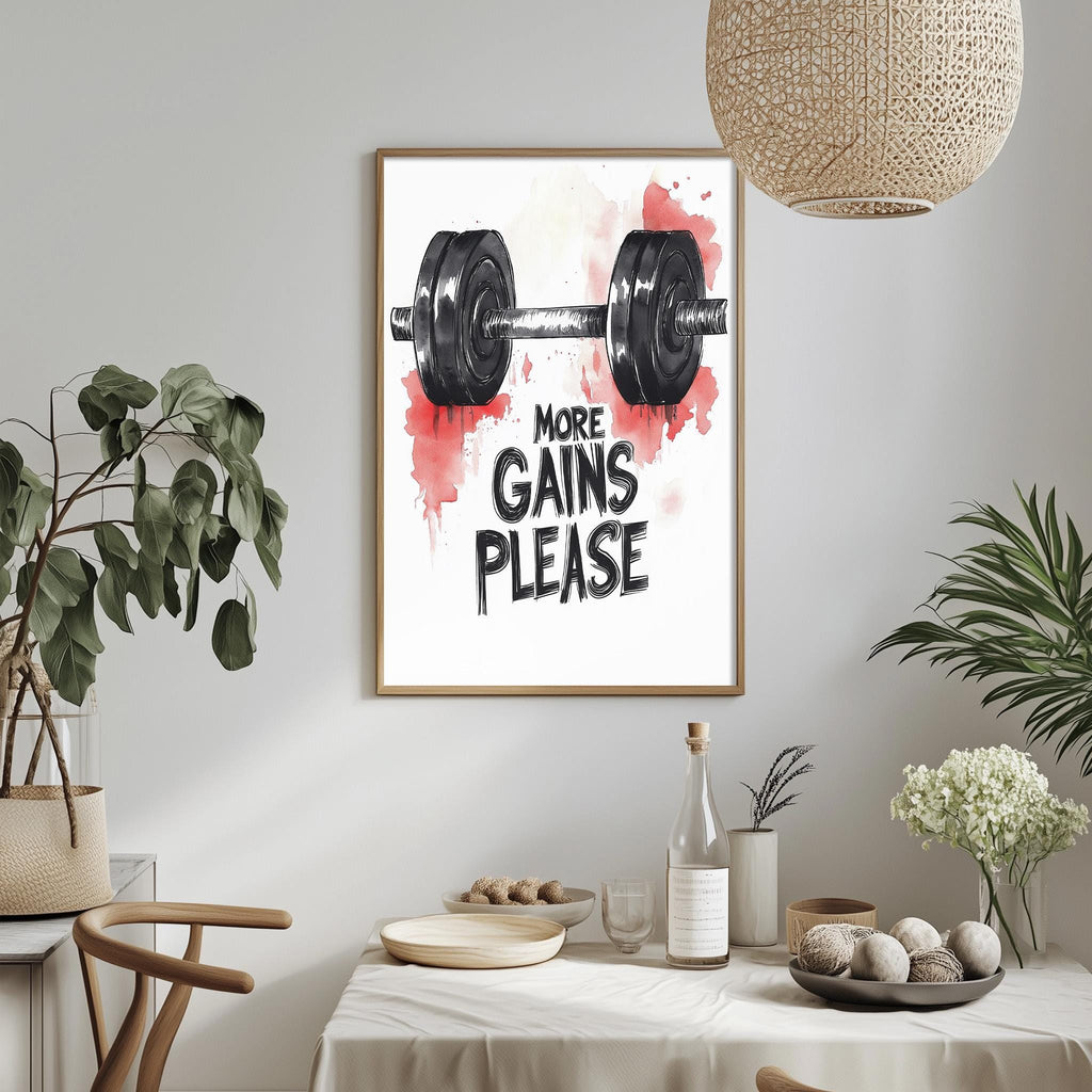 a framed poster with a black and white illustration of a dumbbell and the text "MORE GAINS PLEASE" above it, hanging on a wall above a dining table with various items on it.