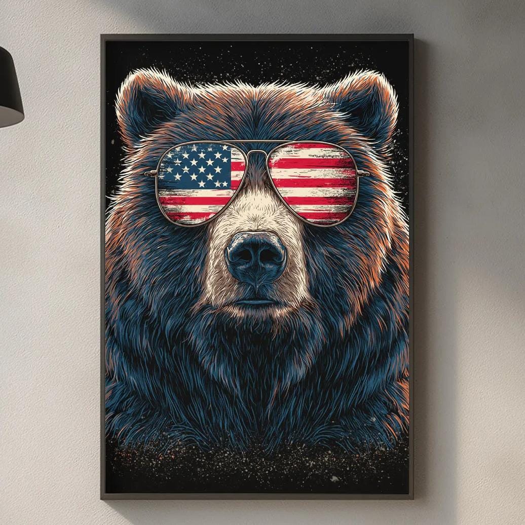 a bear wearing sunglasses with an American flag design, which is displayed on the wall in a kitchen setting.