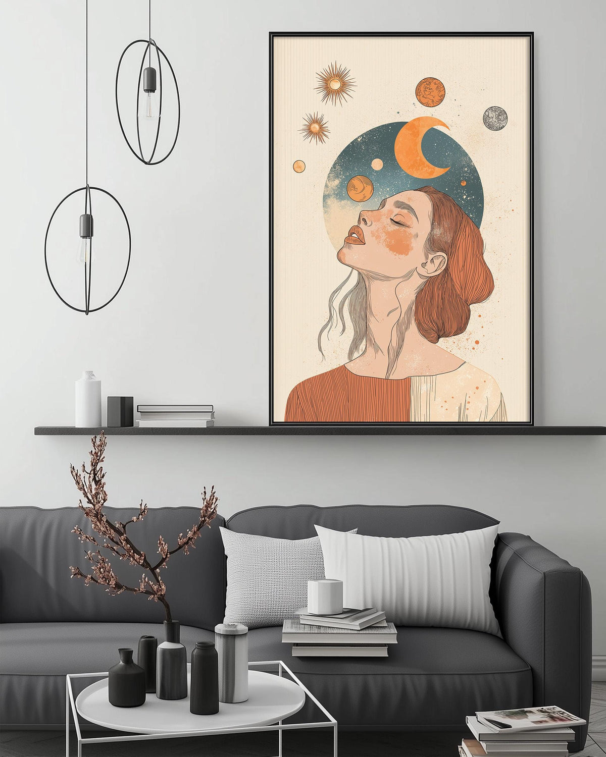 a modern living room with a gray sofa, a coffee table, and a large framed artwork depicting a woman with a crescent moon and stars above her head.