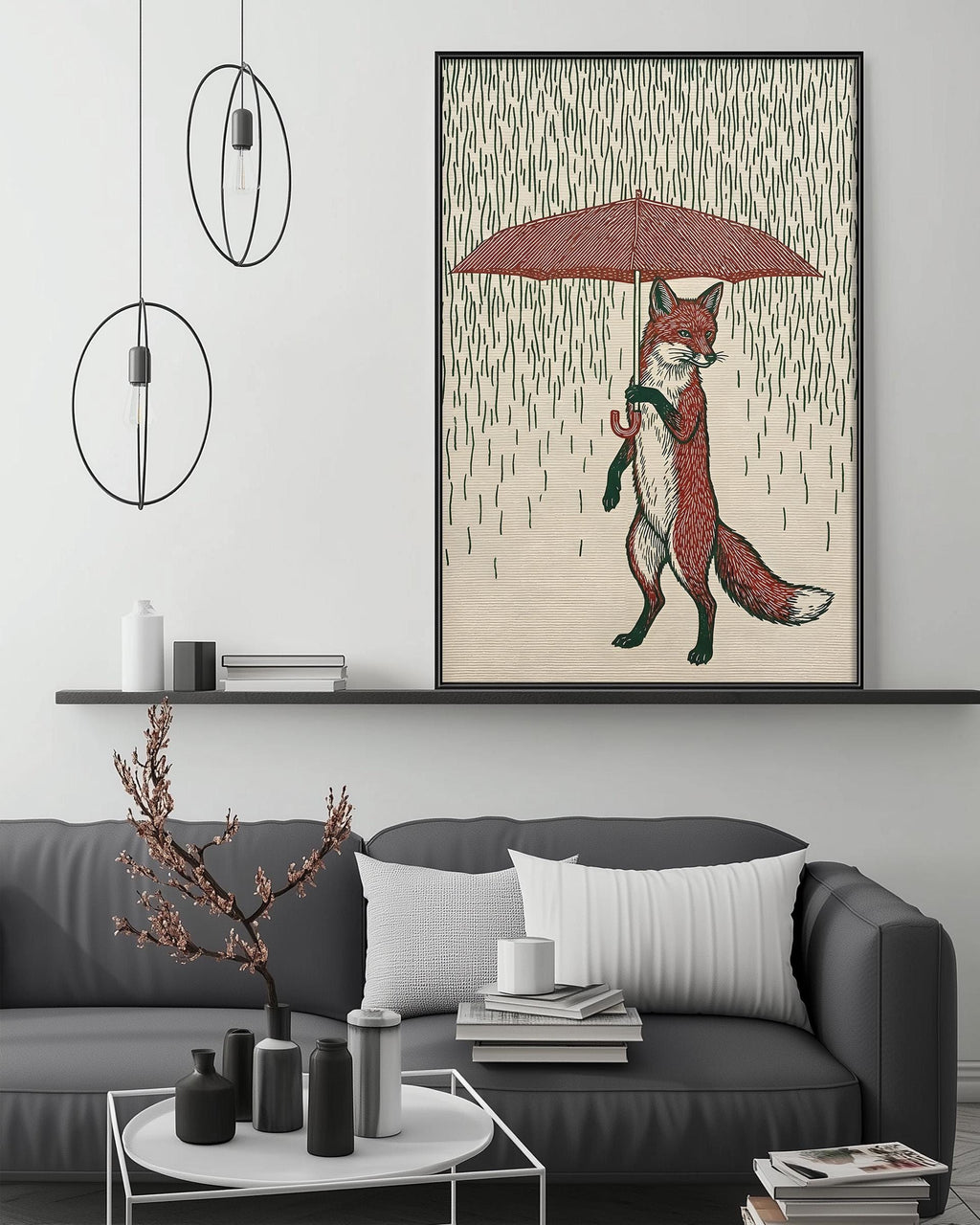 a cozy living room with a gray couch, a coffee table, and a large framed illustration of a fox holding an umbrella. The room has a minimalist and modern design, with a black pendant light hanging above the couch and a white shelf below the artwork.
