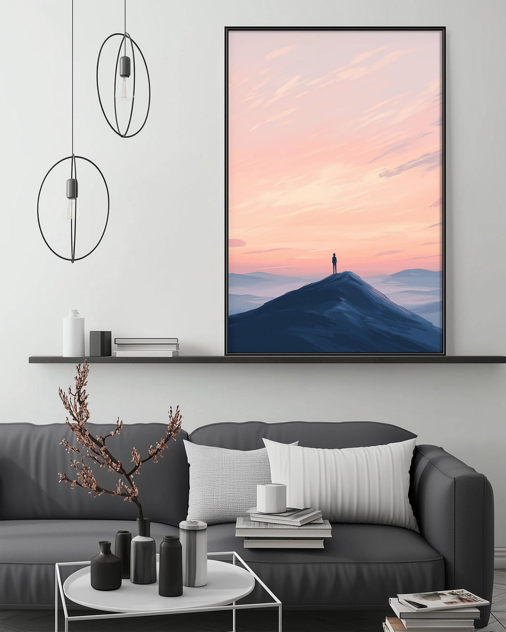 a large framed picture of a person standing on a mountain peak at sunset, with a serene and peaceful atmosphere.