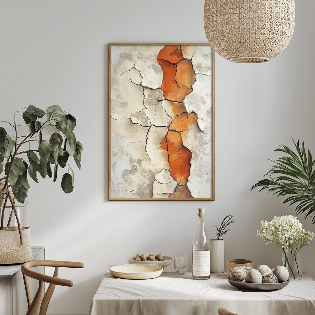a dining room with a white tablecloth, a framed abstract painting hanging on the wall, and various decorative elements such as potted plants, vases, and a bowl of fruit.