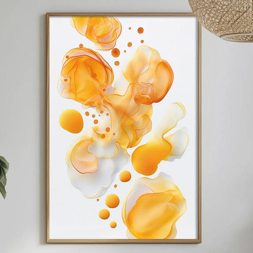 a dining table with a white tablecloth, a bowl of fruit, a bottle, and a vase with flowers. Above the table, there is a framed picture of orange and yellow abstract shapes hanging on the wall.