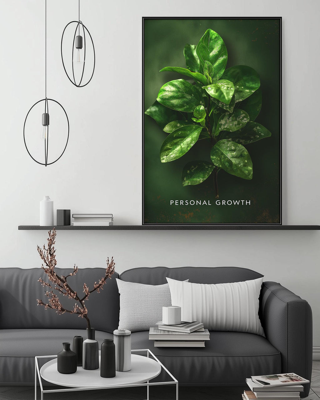 a modern living room with a gray sofa, a coffee table, and a large framed print of a green plant on the wall.